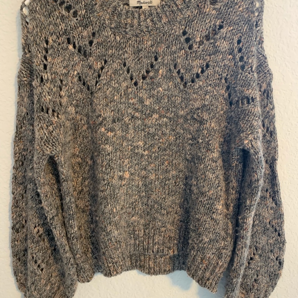 A cute and comfy sweater, stylish, cozy, & nice.